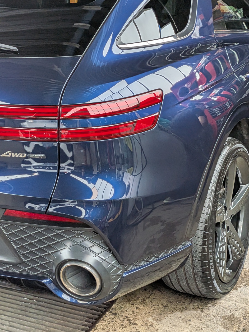 Genesis GV70 rear quarter panel corrected to a deep gloss finish